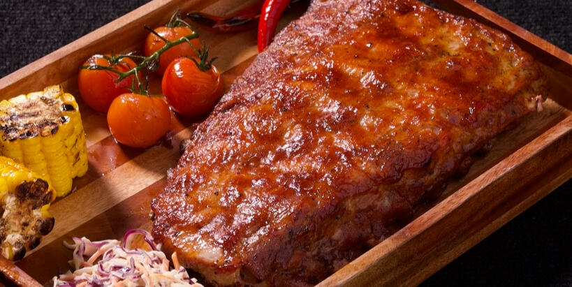 Pork Ribs ( the most tender pork ribs made with the signature sauces and sides )